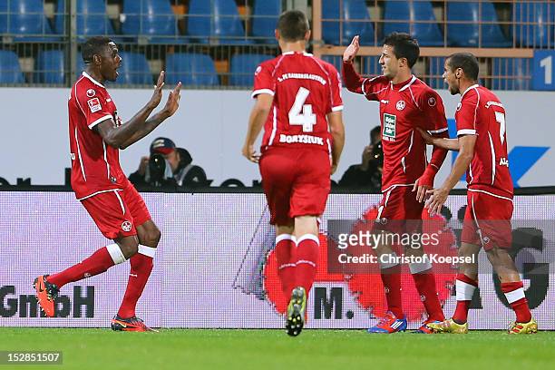 Mohamadou Idrissou of Kaiserslautern celebrates the second goal with Ariel Borysiuk, Ilian Micanski and Mimoun Azaouagh of Kaiserslautern during the...