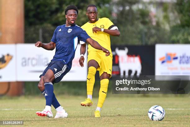 Dilane BAKWA of Bordeaux and Henri SAIVET of Pau during the friendly match between Girondins de Bordeaux and Pau FC on July 12, 2023 in La...