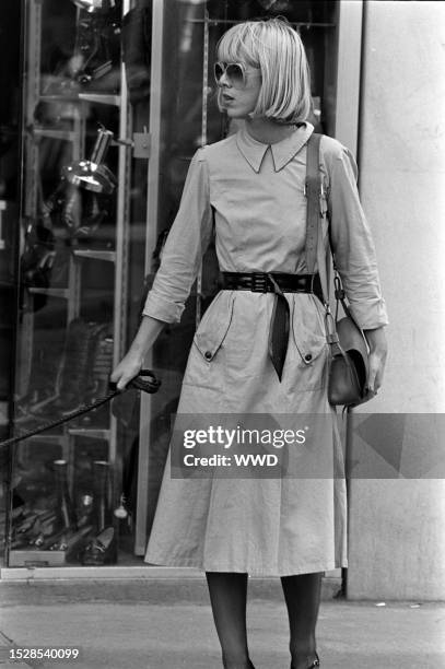 Candid street style photography taken on the streets of Paris on August 19, 1974.