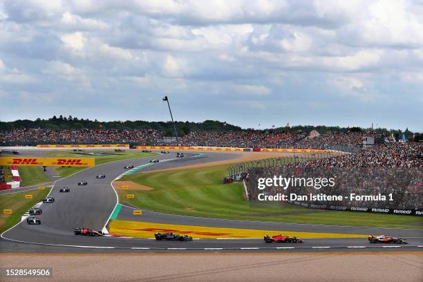 General view as Oscar Piastri of Australia driving the McLaren MCL60 Mercedes leads Charles Leclerc of Monaco driving the Ferrari SF-23, George...