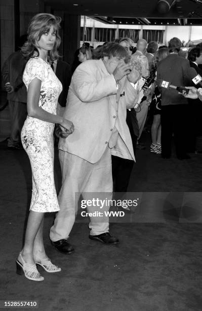 Lorri Bagley and Chris Farley attend the Los Angeles premiere of "Nine Months" at the Cineplex Odeon Century City Cinemas in Century City,...