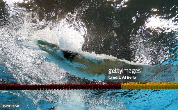 Michael Phelps of the United States dives into the pool in the Men's 100m Meldey Final on Day 8 of the London 2012 Olympic Games at the Aquatics...