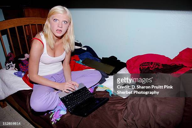 girl in bed - messy bedroom stock-fotos und bilder