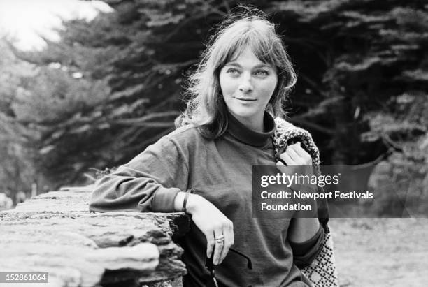 Folk singer Judy Collins poses for a portrait backstage at the Newport Folk Festival in July, 1964 in Newport, Rhode Island.