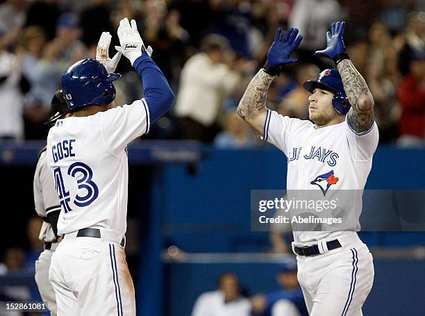Anthony Gose and Brett Lawrie of the Toronto Blue Jays celebrate Lawrie's two-run home run against the New York Yankees during MLB action at the...