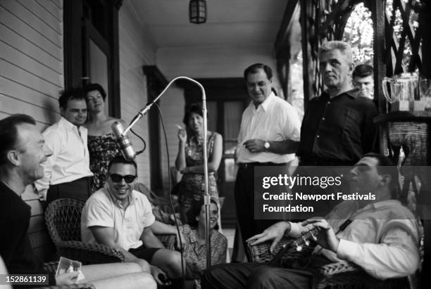 Folk singer and activist Pete Seeger is interviewed by folk singer and actor Theodore Bikel backstage at the Newport Folk Festival in July, 1960 in...