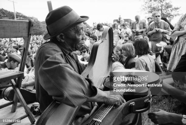 Blues singer Mississippi John Hurt performs at the Newport Folk Festival in July, 1965 in Newport, Rhode Island.