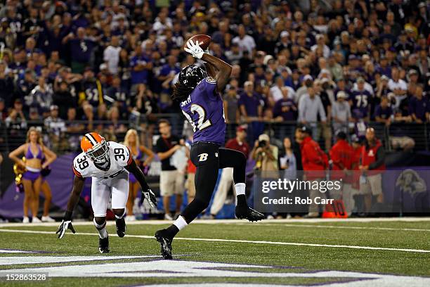 Wide receiver Torrey Smith of the Baltimore Ravens catches a touchdown pass in the second quarter against cornerback Tashaun Gipson of the Cleveland...