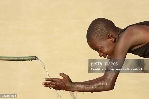 boy washing hands - commerceandculturestock stock pictures, royalty-free photos & images