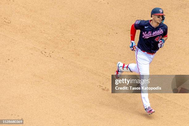 Joey Meneses of the Washington Nationals rounds second base after his home run against the Texas Rangers at Nationals Park on July 09, 2023 in...