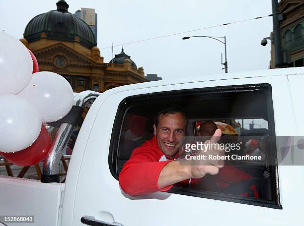 Jude Bolton of the Swans waves to the fans during the 2012 AFL Grand Final Parade on September 28, 2012 in Melbourne, Australia.
