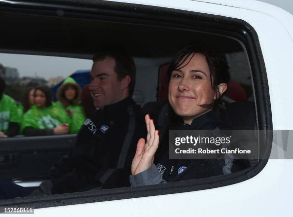 AFL goal umpire Chelsea Roffey waves to the fans during the 2012 AFL ...