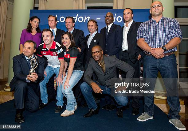 Governor of Rio de Janeiro, Sergio Cabral, British Prime Minister David Cameron, Major Eduardo Paes, Emerson Fittipaldi and Edwin Moses with...