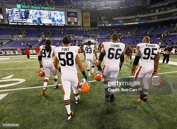 Jabaal Sheard, John Hughes, Marcus Benard, Shawn Lauvao, and Juqua Parker of the Cleveland Browns walk off the field after losing to the Baltimore...