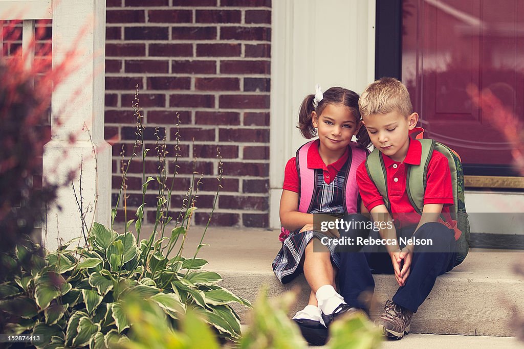Child Stooping School Children On Front Stoop High-Res Stock Photo - Getty Images
