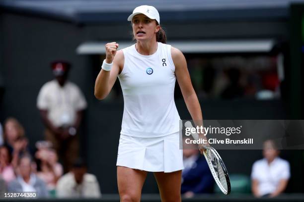 Iga Swiatek of Poland celebrates winning match point against Belinda Bencic of Switzerland in the Women's Singles fourth round match during day seven...