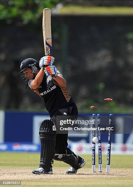 Suzie Bates of New Zealand is bowled out by Susan Benade of South Africa during the ICC Women's World Twenty20 Group B match between New Zealand and...