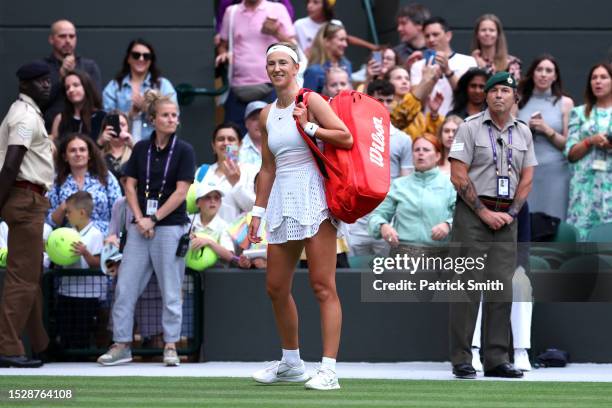 Victoria Azarenka leaves the court following defeat against Elina Svitolina of Ukraine in the Women's Singles fourth round match during day seven of...