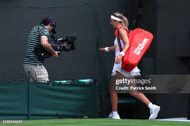 Victoria Azarenka leaves the court following defeat against Elina Svitolina of Ukraine in the Women's Singles fourth round match during day seven of...