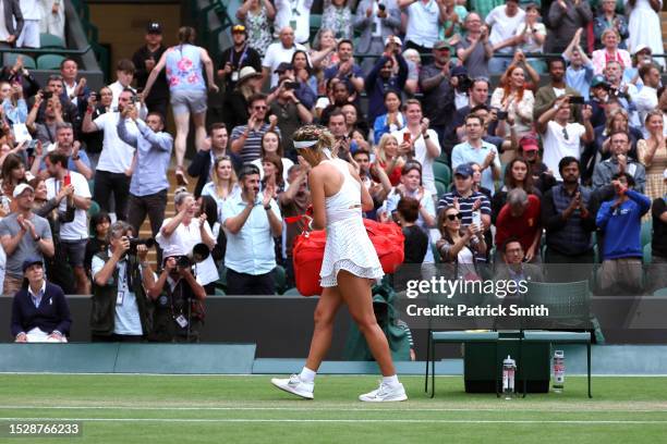 Victoria Azarenka leaves the court following defeat against Elina Svitolina of Ukraine in the Women's Singles fourth round match during day seven of...