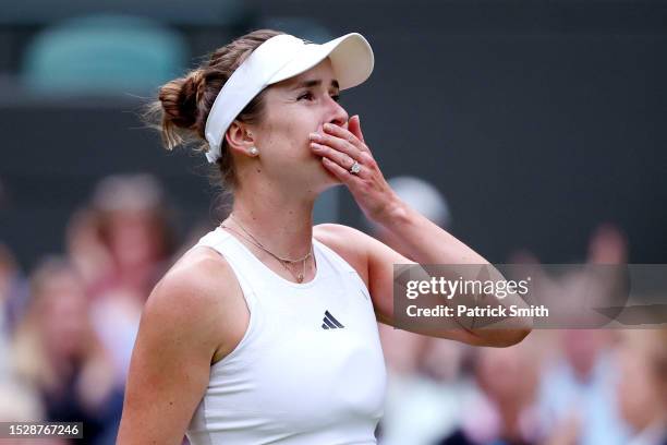 Elina Svitolina of Ukraine celebrates winning match point against Victoria Azarenka in the Women's Singles fourth round match during day seven of The...