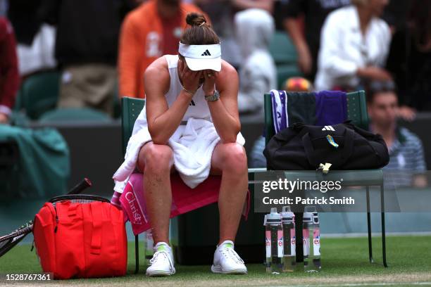 Elina Svitolina of Ukraine reacts after winning match point against Victoria Azarenka in the Women's Singles fourth round match during day seven of...