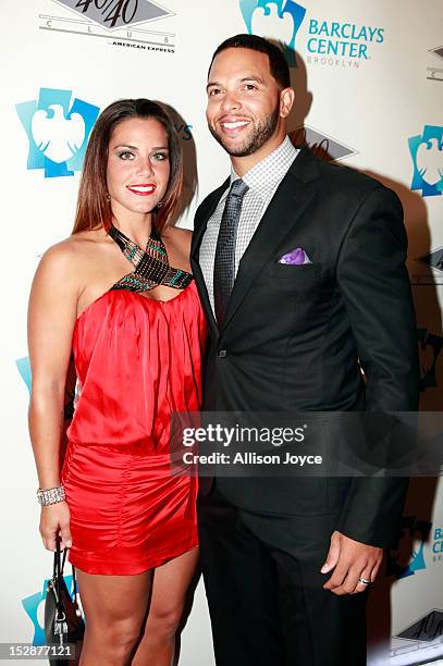 Deron Williams and his wife Amy Williams attend the grand opening of the 40/40 Club at Barclays Center on September 27, 2012 in the Brooklyn borough...