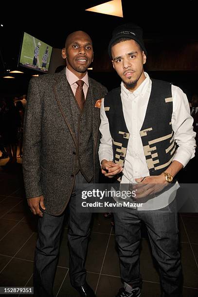Jerry Stackhouse and J Cole attend the grand opening of the 40/40 Club at Barclays Center on September 27, 2012 in the Brooklyn borough of New York...