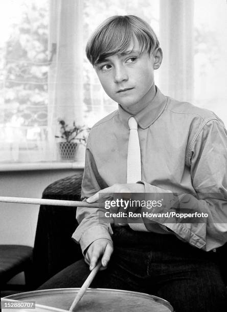 English singer, actor and musician Phil Collins seated at a drum kit in London circa 1965. Phil Collins has recently been cast as the Artful Dodger...