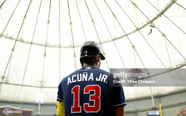 Ronald Acuna Jr. #13 of the Atlanta Braves looks on during a game against the Tampa Bay Rays at Tropicana Field on July 09, 2023 in St Petersburg,...