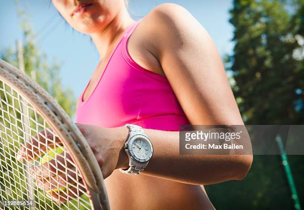close up of tennis players watch - tennis raquet close up photos et images de collection