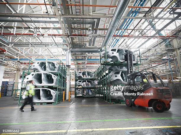 car parts in car factory - automobilbau stock-fotos und bilder