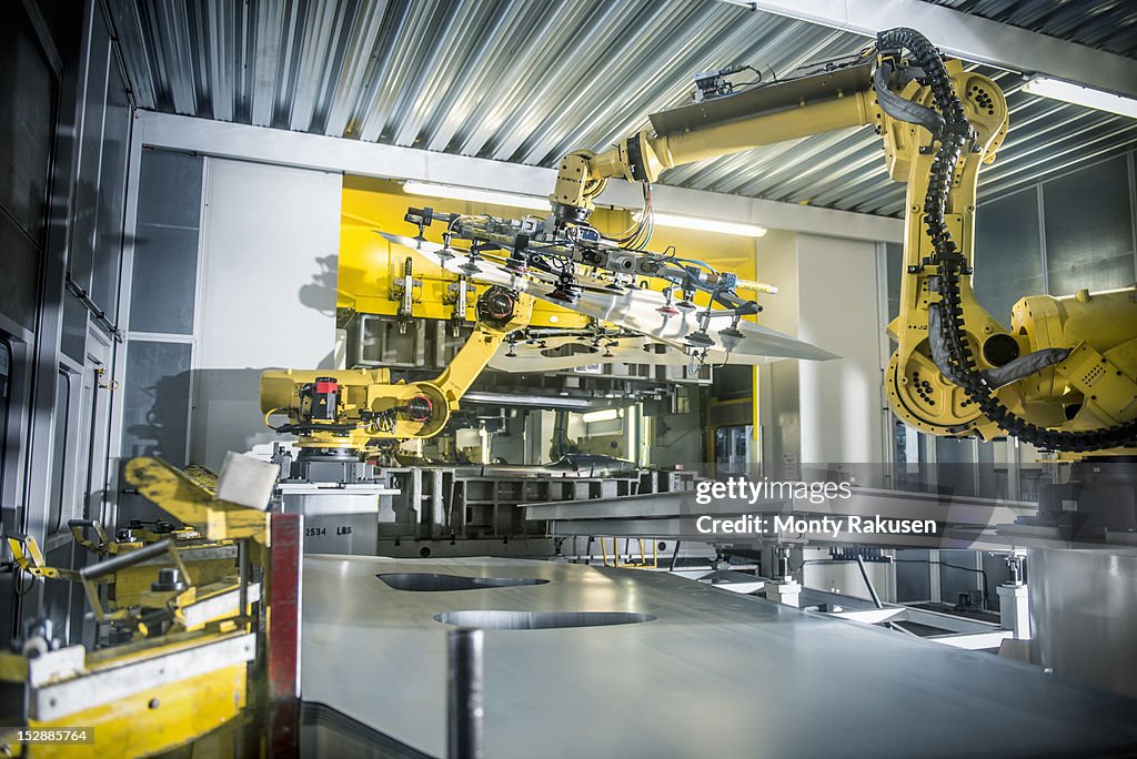 Car parts handled by robots in car factory