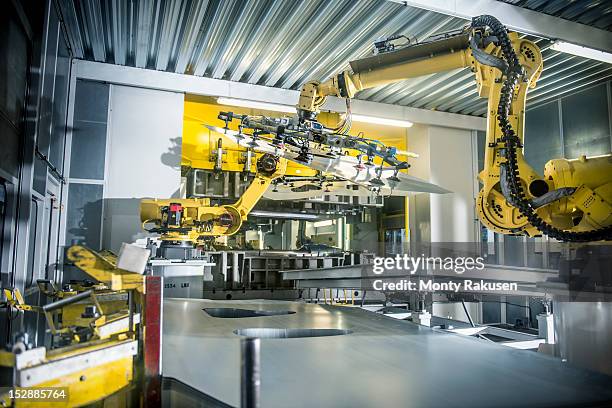 Car parts handled by robots in car factory