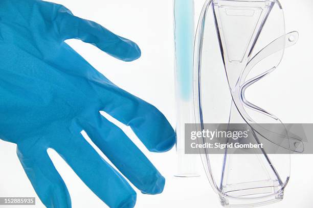 latex glove, goggles and test tube - laboratoriumglas stockfoto's en -beelden