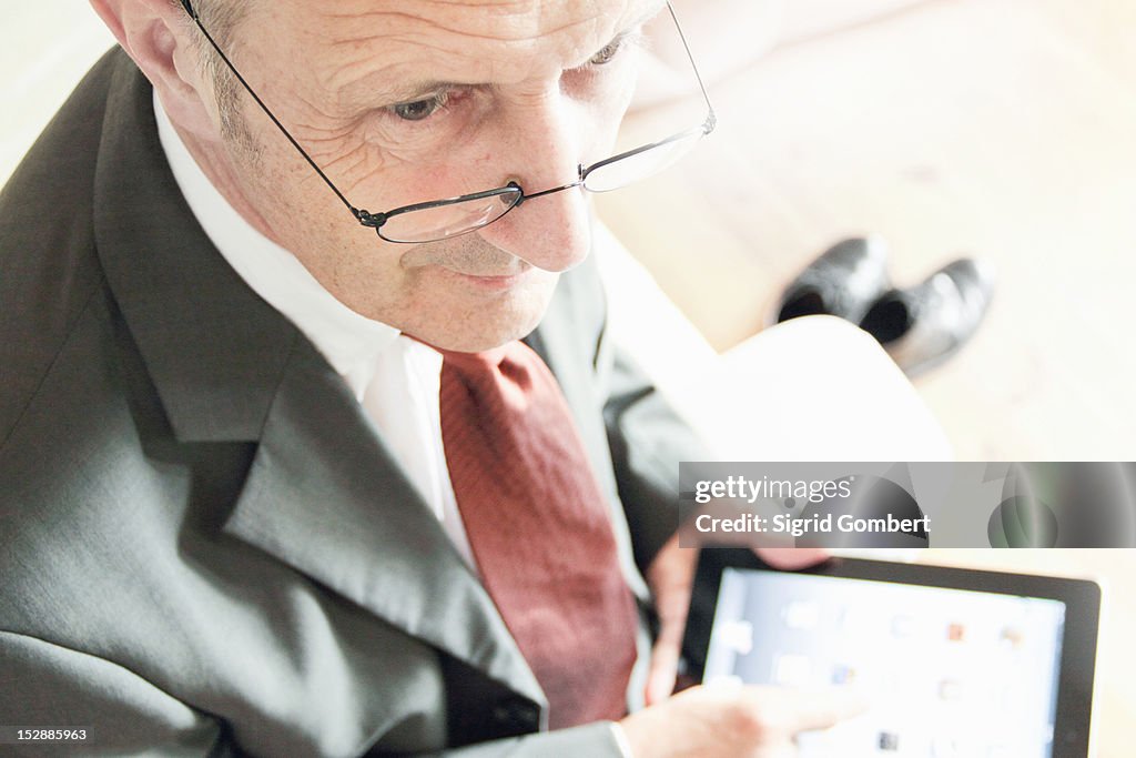 Businessman using tablet computer