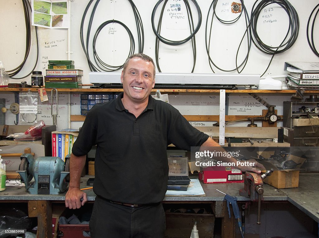 Worker smiling in workshop