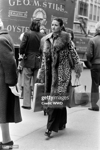 Street style captured on Fifth Avenue in New York City on November 25, 1974.