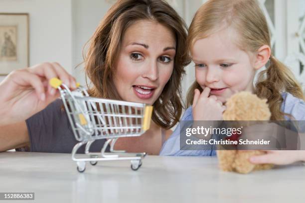 mother and daughter playing with toys - christine young stock pictures, royalty-free photos & images