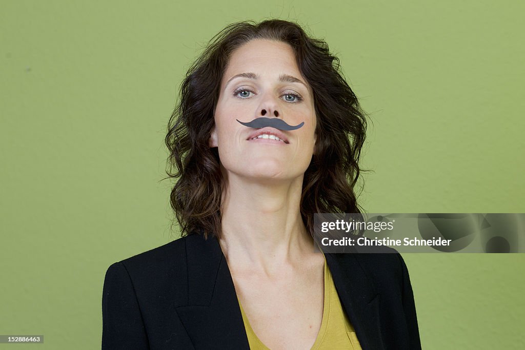 Woman wearing fake mustache