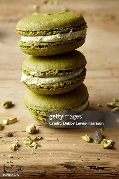 stack of macaroons on table - macaron stock pictures, royalty-free photos & images