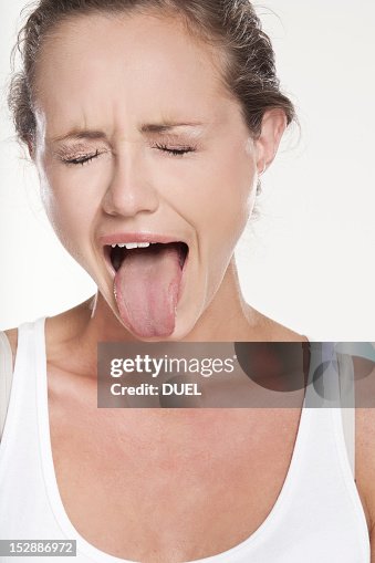 Close up of woman grimacing Close up of woman grimacing