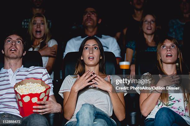 audience in movie theater with shocked expressions - film 2012 fotografías e imágenes de stock