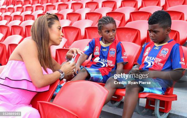 Chantelle Tagoe , fiancee of Emile Heskey of Newcastle Jets and their children Reigan Heskey and Jaden Heskey , look on during their fathers first...