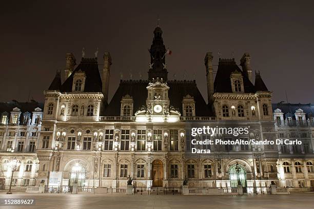 france, paris, hotel de ville illuminated at night - hôtel de ville de paris photos et images de collection