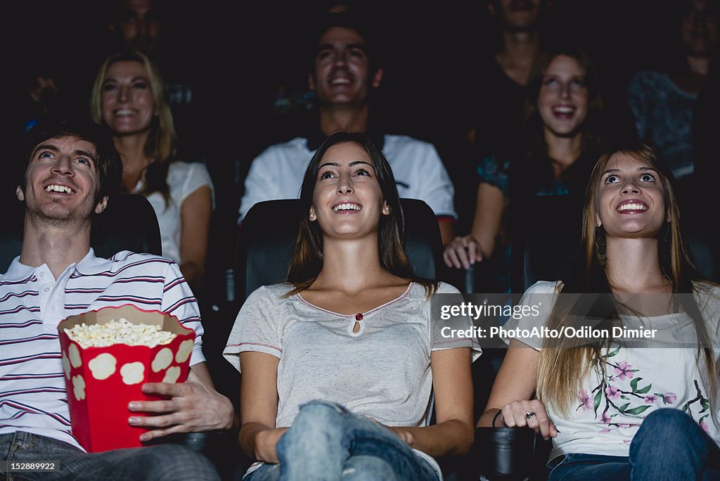 Audience watching movie in theater