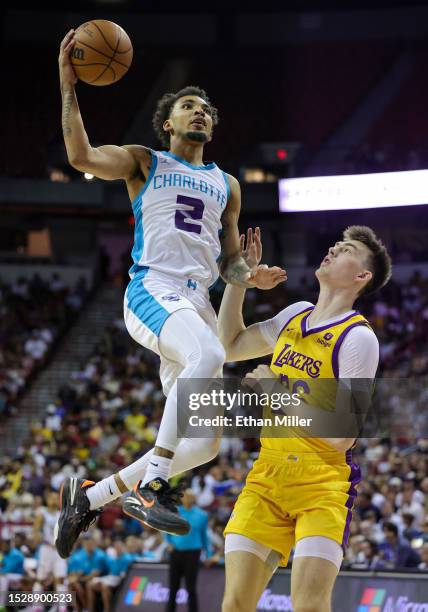 James Bouknight of the Charlotte Hornets drives to the basket against Colin Castleton of the Los Angeles Lakers in the first half of a 2023 NBA...