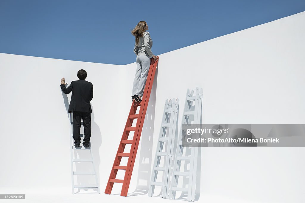 Businesswoman at top of ladder