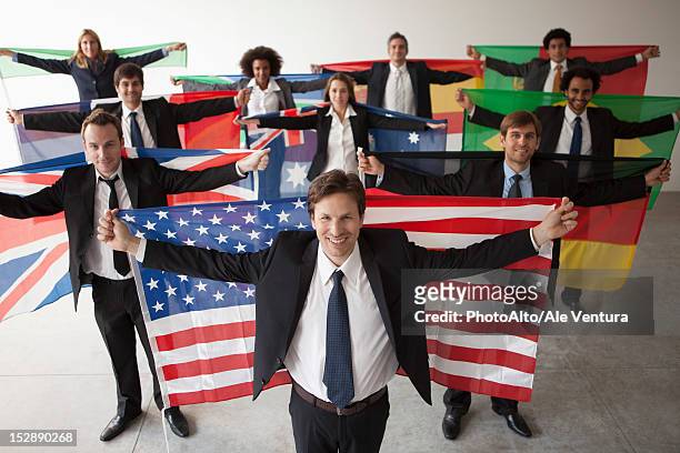 nations vie for shares of global business - international flags stock-fotos und bilder
