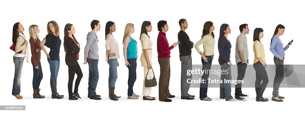 Studio shot of people waiting in line